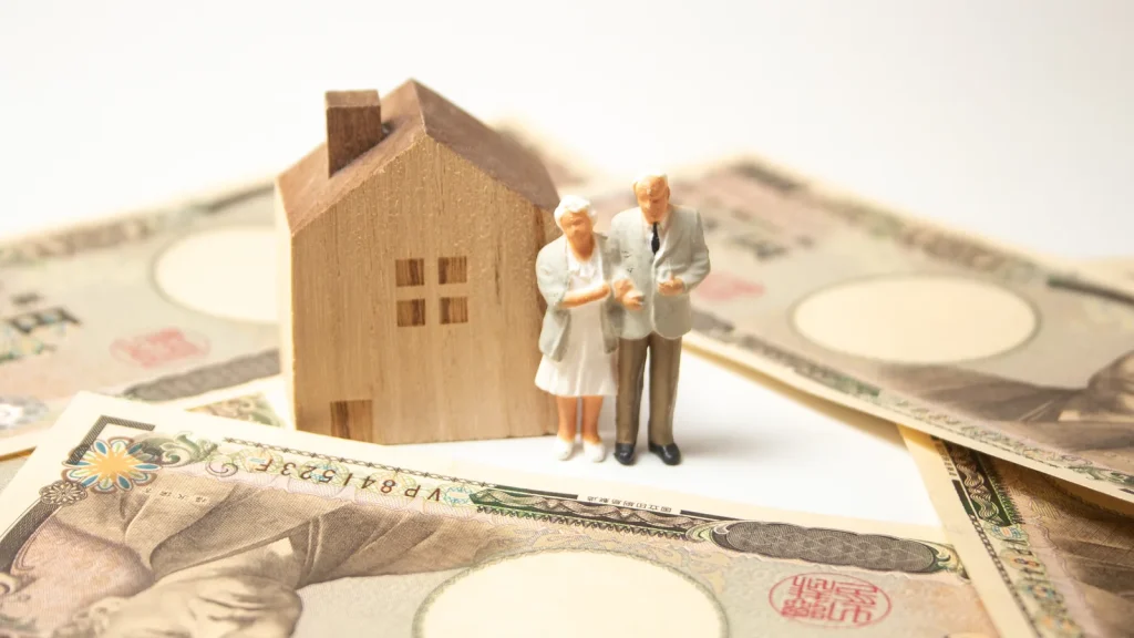家族と住まいと現金を表すイメージ